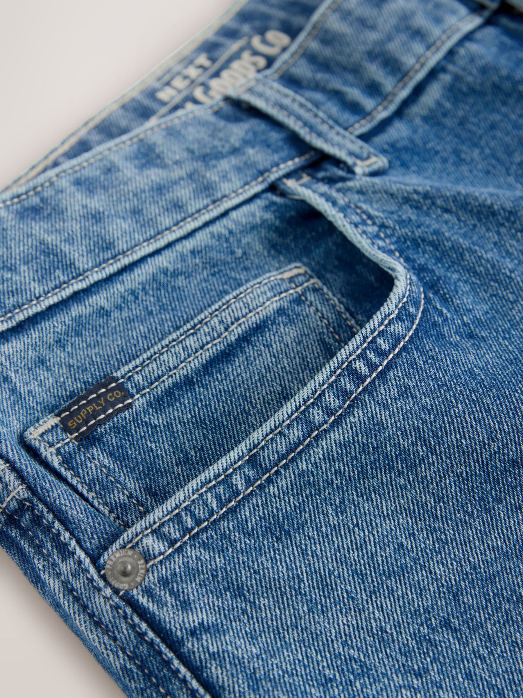 Buy Blue Mid Tint Straight Fit Vintage Wash Denim Jeans from Next