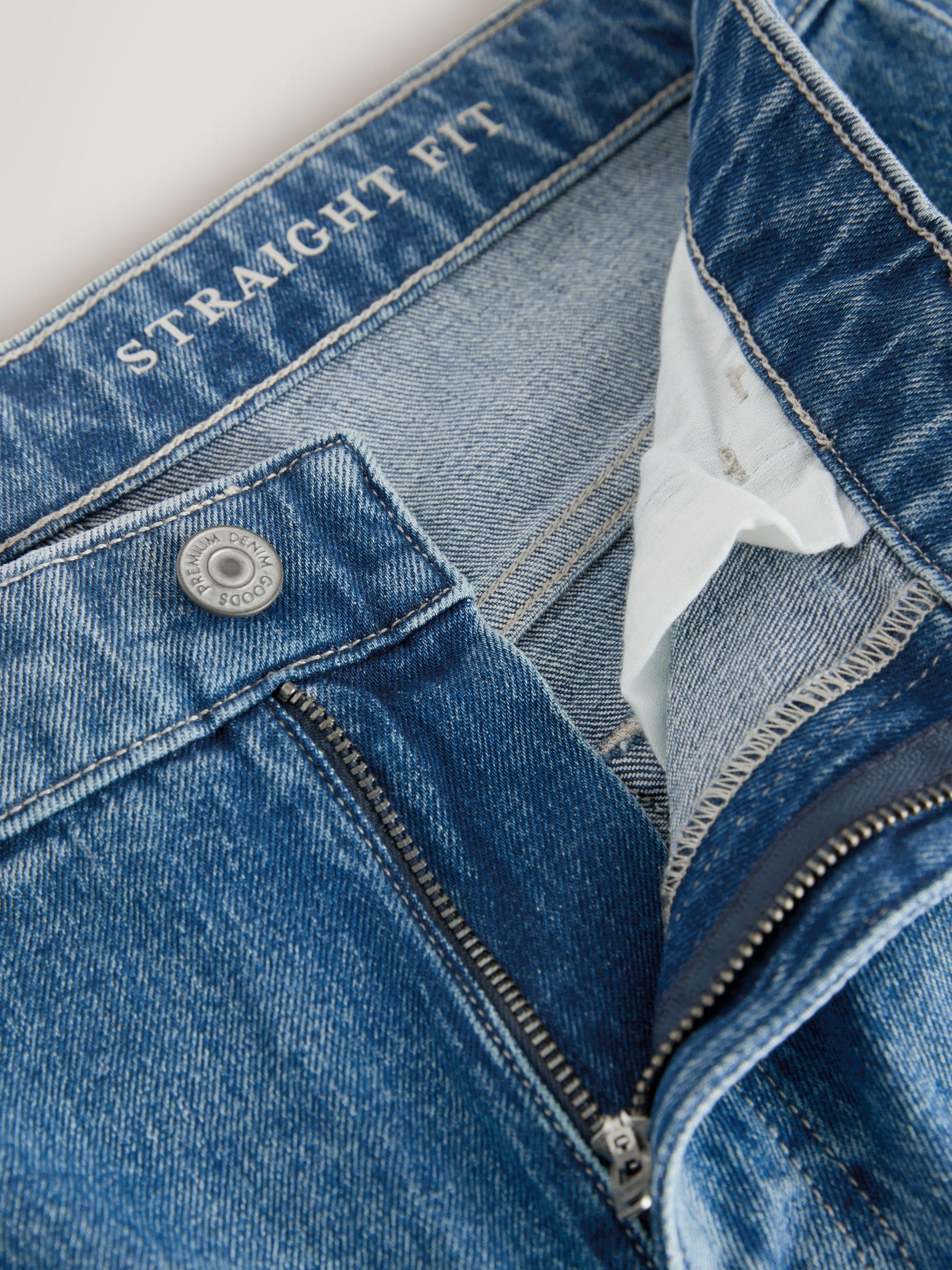 Buy Blue Mid Tint Straight Fit Vintage Wash Denim Jeans from Next