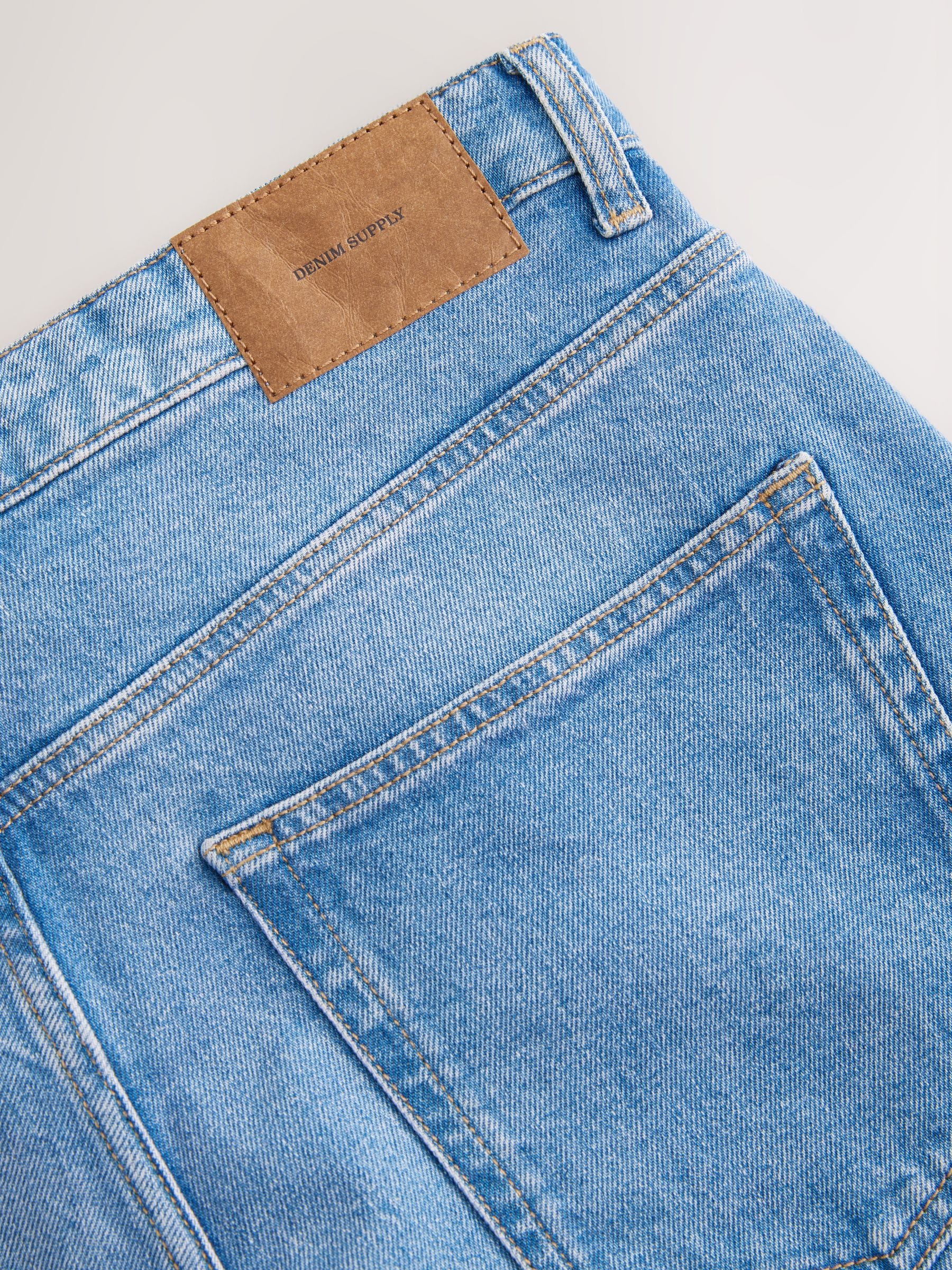Buy Blue Light Straight Fit Vintage Wash Denim Jeans from Next USA