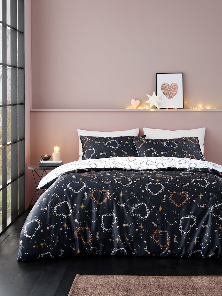 Catherine Lansfield Black and White Cosmic Hearts and Stars Soft Satin Duvet Cover Set - Image 1 of 5