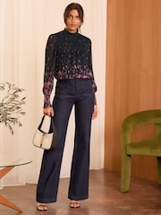 Love & Roses Black and Pink Floral Print Plisse Mesh Long Sleeve Jersey Blouse - Image 1 of 4