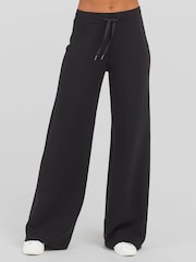 Spanx Black AirEssentials® Petite Wide Leg Pants - Image 1 of 4