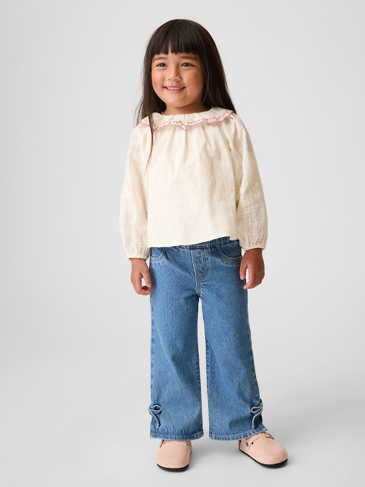 Gap Blue Medium Wash Bow Split-Hem Stride Jeans (6mths-5yrs) - Image 1 of 3 Gap Blue Medium Wash Bow Split-Hem Stride Jeans (6mths-5yrs) - Image 1 of 3