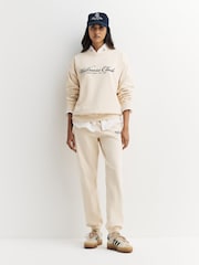 Sporty & Rich Cream Wellness Club MC Embroidered Joggers - Image 1 of 5
