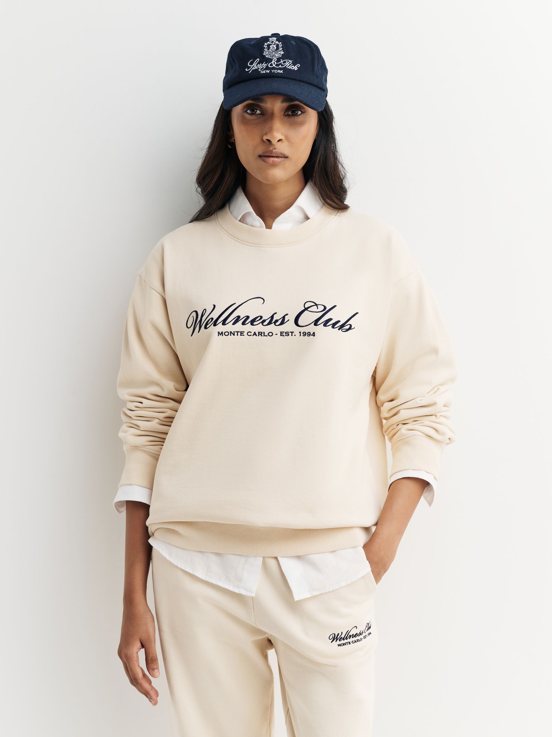 Buy Sporty & Rich Cream Wellness Club MC Embroidered Crewneck