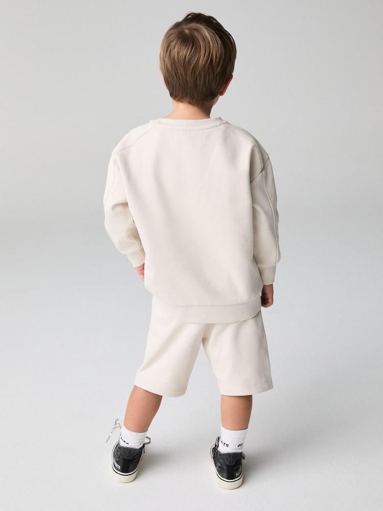smALLSAINTS Natural Younger Boys Oversized Ramskull Sweatshirt and Shorts Set - Image 2 of 8 smALLSAINTS Natural Younger Boys Oversized Ramskull Sweatshirt and Shorts Set - Image 2 of 8