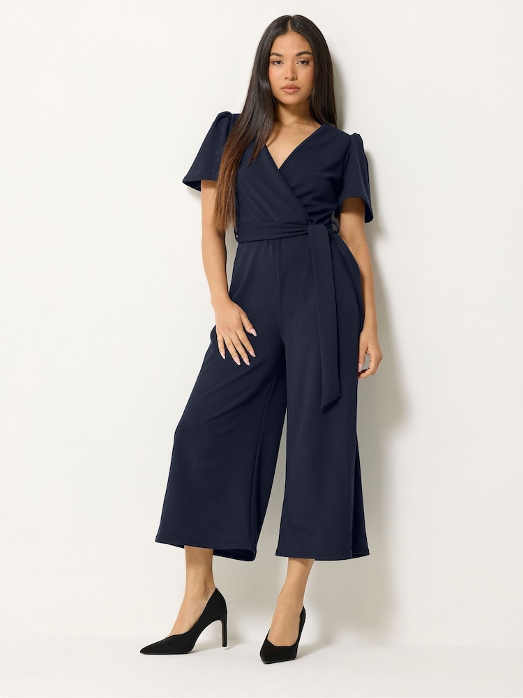 M&Co Blue Petite Cropped Tie Waist Jumpsuit - Image 1 of 5 M&Co Blue Petite Cropped Tie Waist Jumpsuit - Image 1 of 5