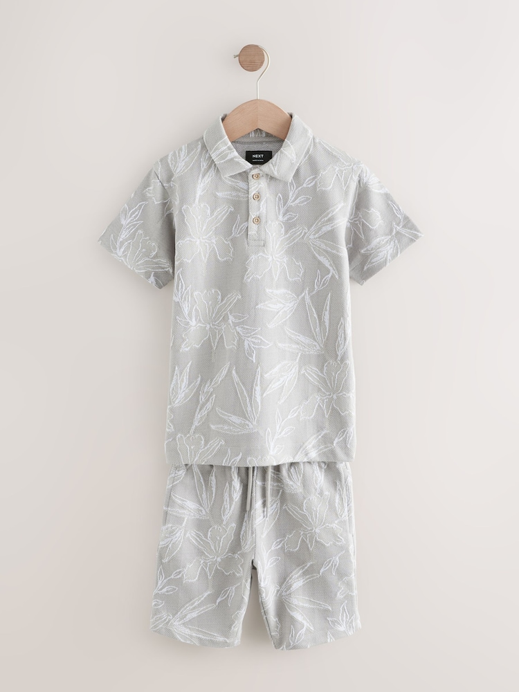 Gris - Conjunto de polo de manga corta y pantalón corto de jacquard (3-16 años) - Imagen 1 de 5 Gris - Conjunto de polo de manga corta y pantalón corto de jacquard (3-16 años) - Imagen 1 de 5