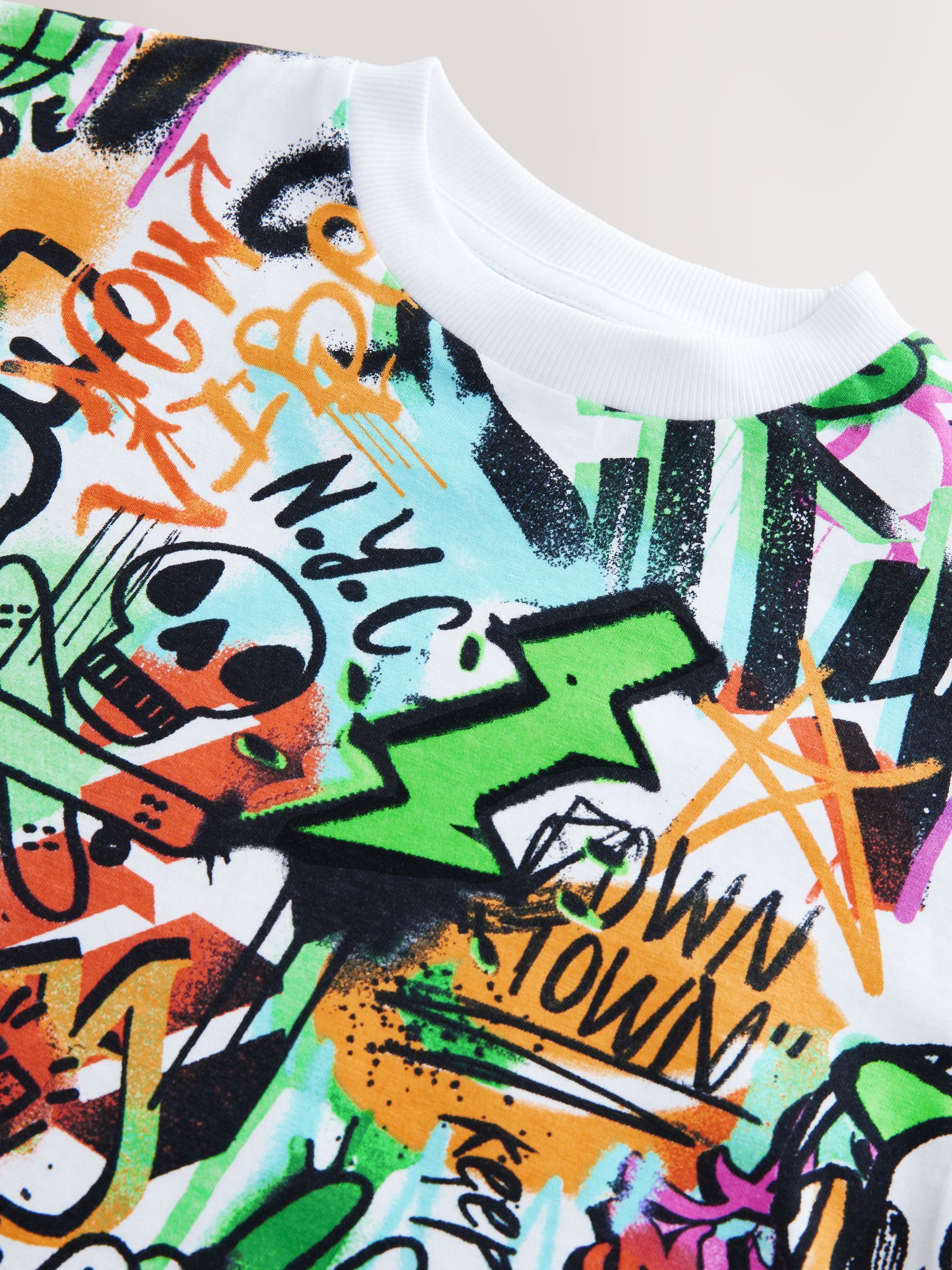 Buy White/Multi Graffiti Relaxed Fit Short Sleeve Graphic Print T Buy White/Multi Graffiti Relaxed Fit Short Sleeve Graphic Print T