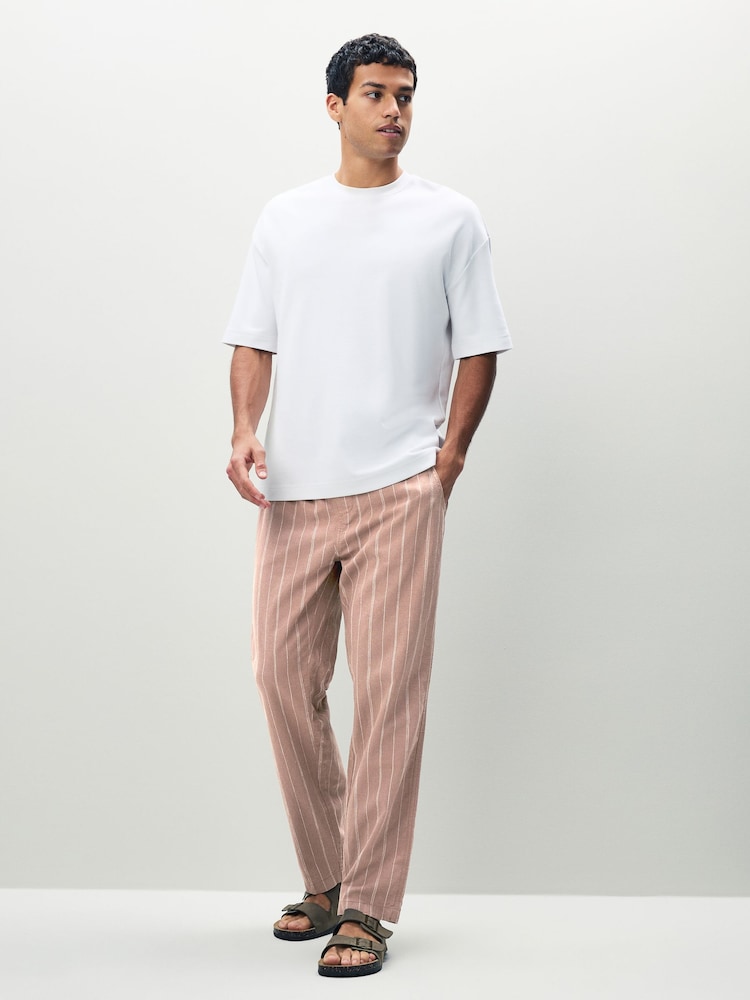 Rosa/blanco - Ajuste tapered regular - Pantalones de lino y algodón a rayas - Imagen 2 de 10 Rosa/blanco - Ajuste tapered regular - Pantalones de lino y algodón a rayas - Imagen 2 de 10