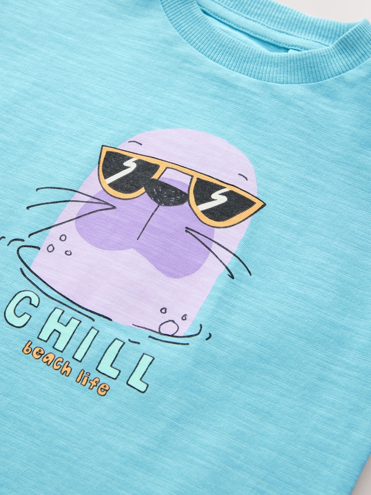 Azul con texto Chill Seal - Camiseta de 100% algodón de manga corta con estampado gráfico (6 meses-7 años) - Imagen 4 de 4 Azul con texto Chill Seal - Camiseta de 100% algodón de manga corta con estampado gráfico (6 meses-7 años) - Imagen 4 de 4