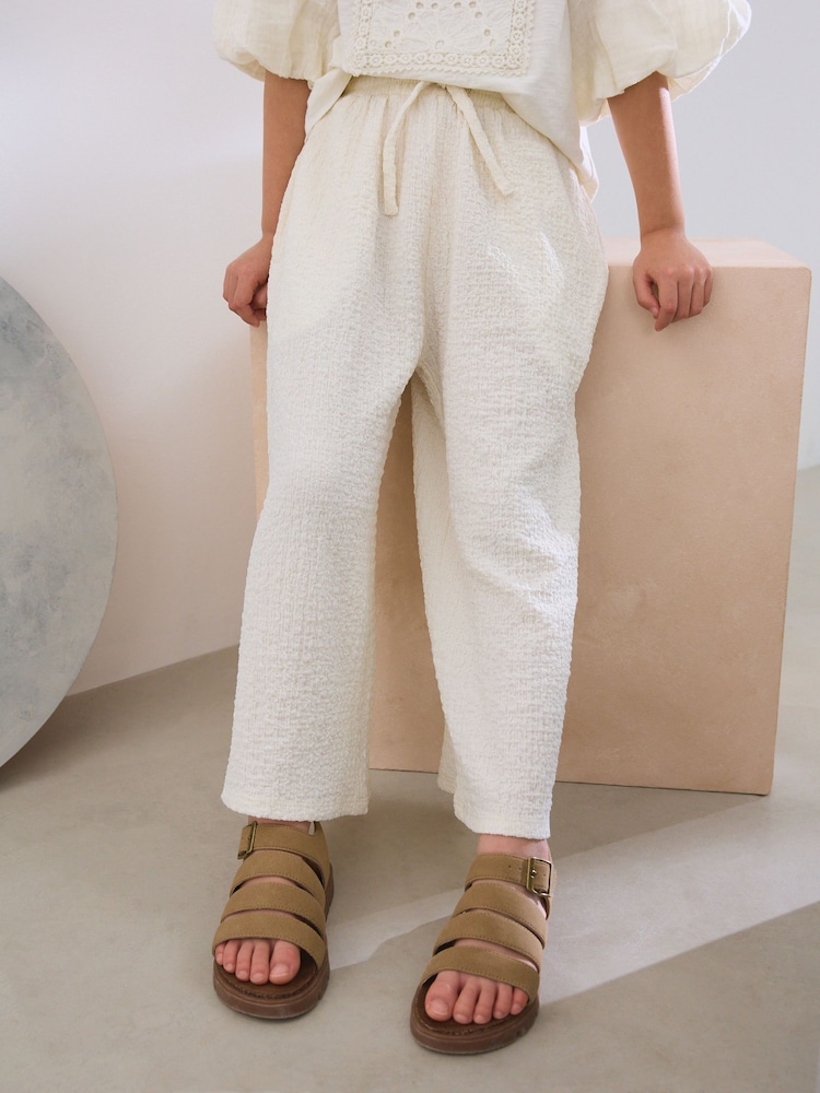 Strukturiert, Creme - Bedruckte Hose mit weitem Bein (3–16 J.) - Bild 1 von 5 Strukturiert, Creme - Bedruckte Hose mit weitem Bein (3–16 J.) - Bild 1 von 5