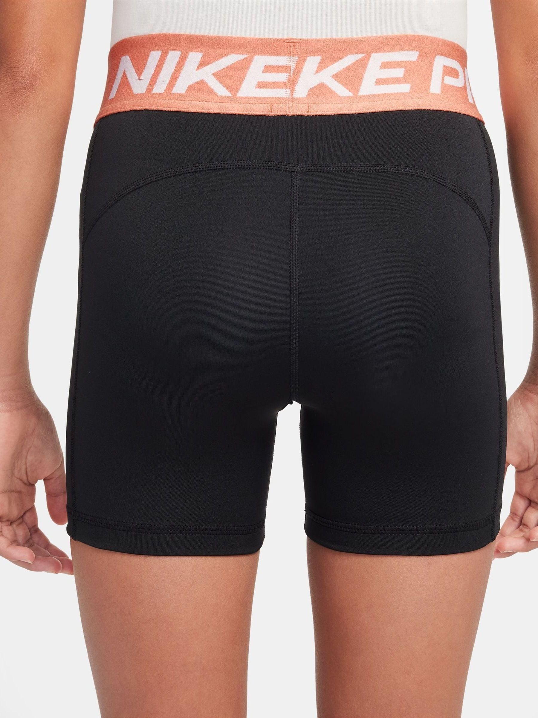 nike women's black and orange shorts