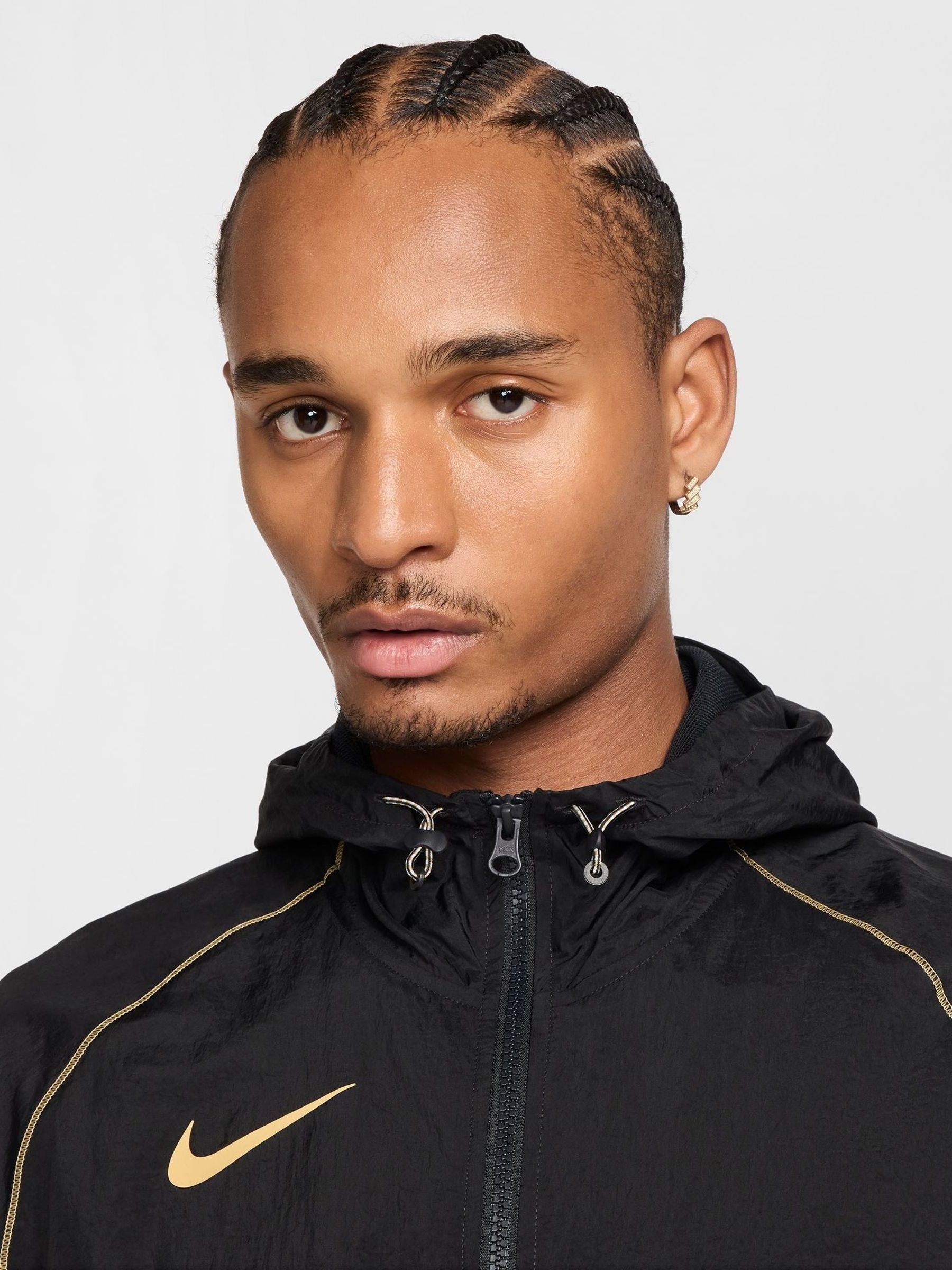 nike black and gold jacket