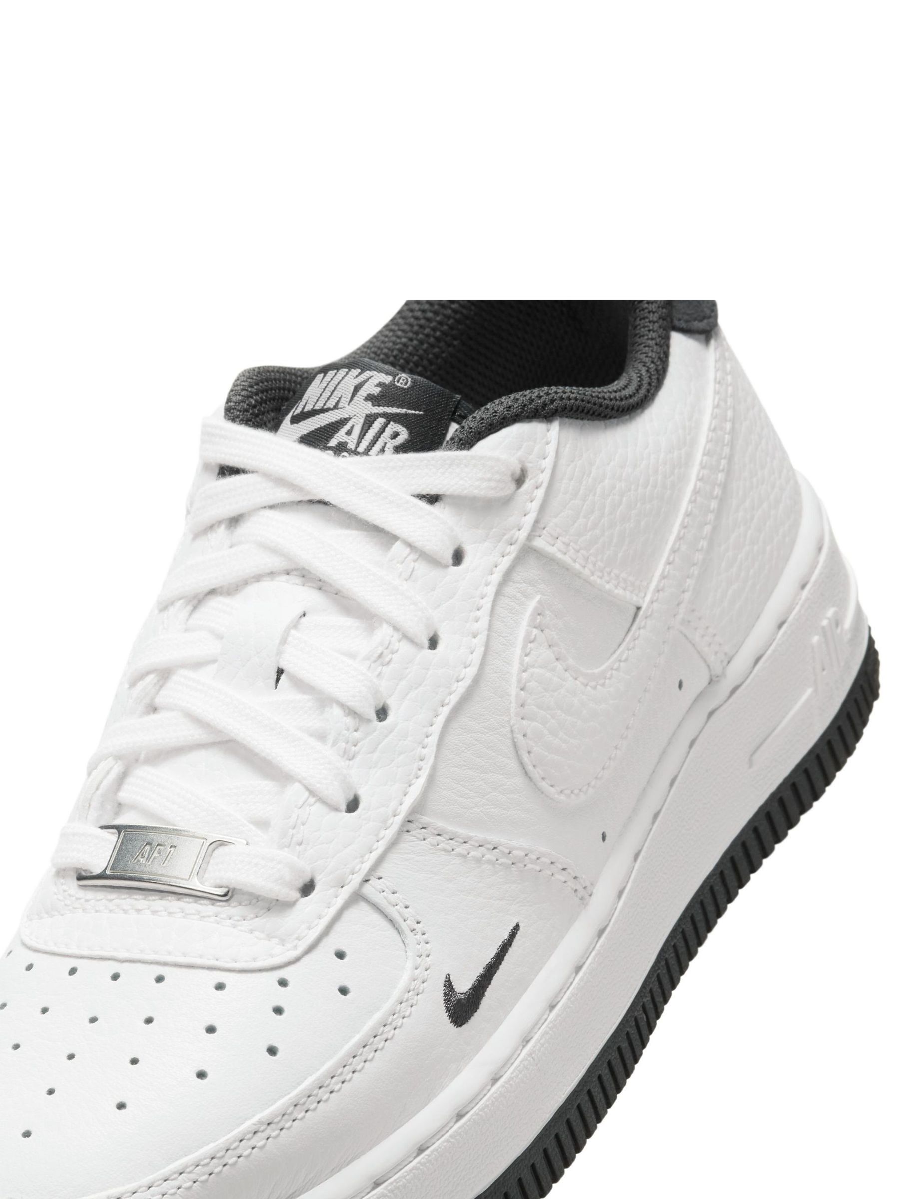 white forces with black nike sign