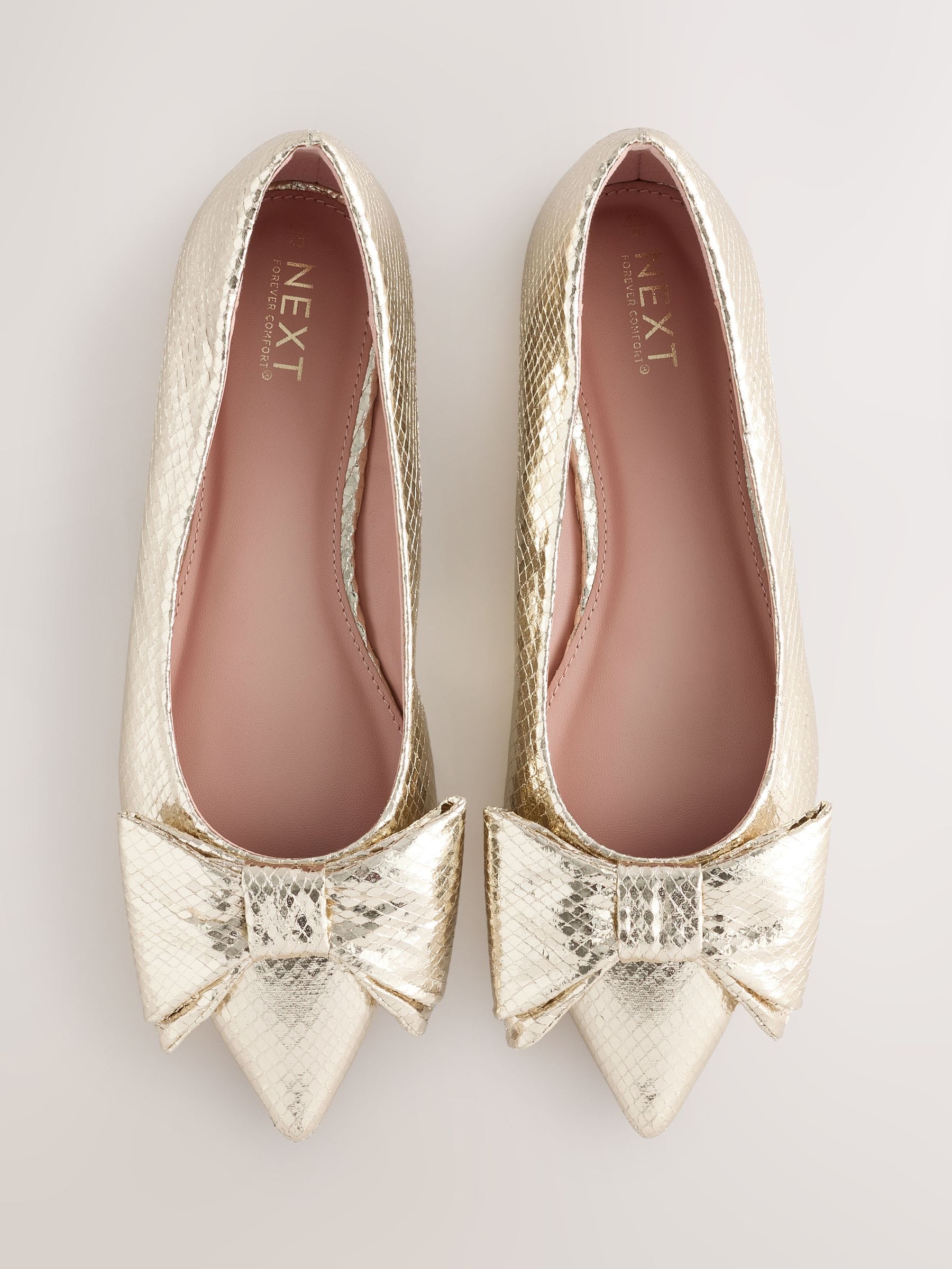 Buy Gold Forever Comfort® Point Toe Bow Ballerinas from Next USA