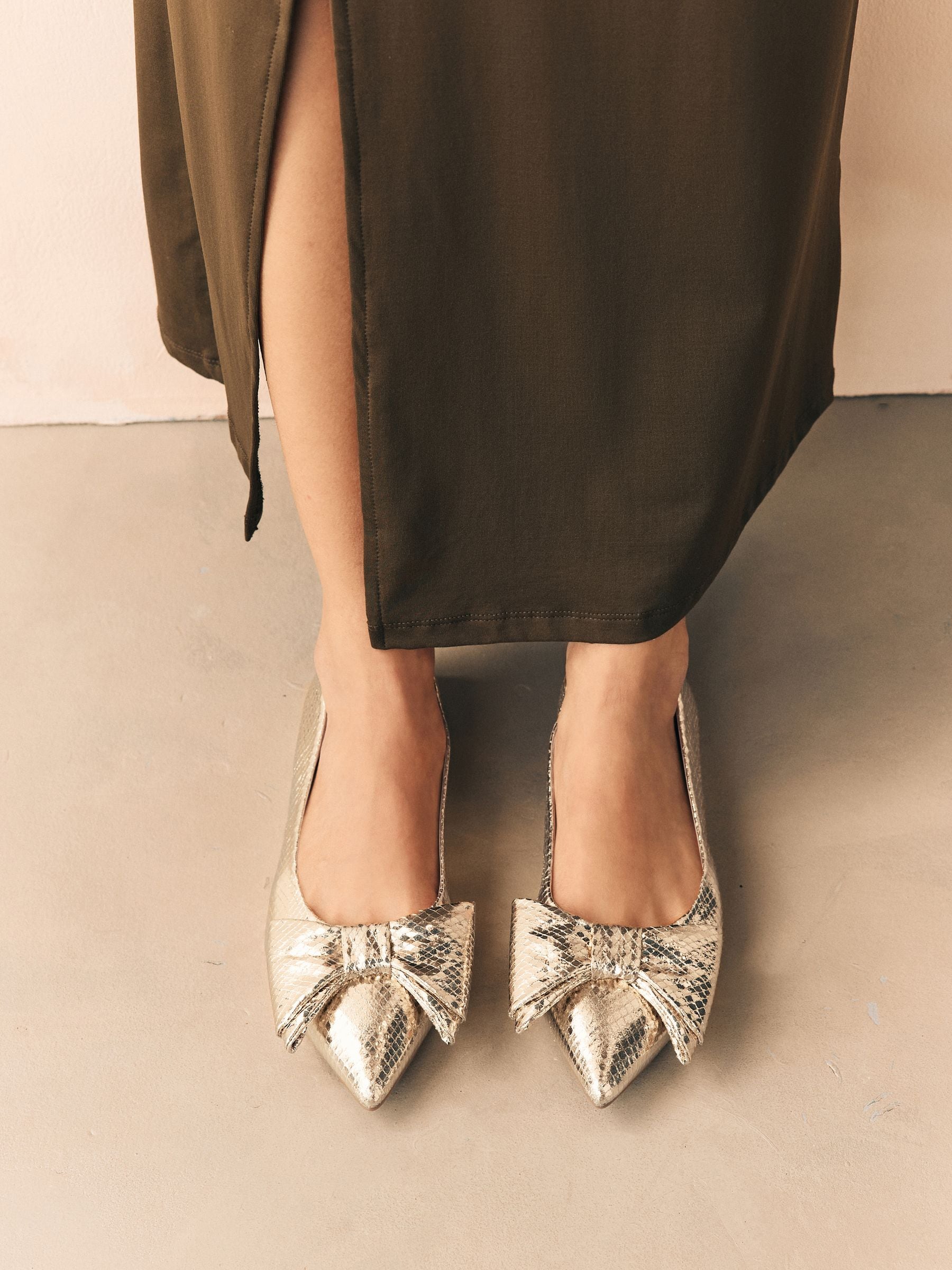 Buy Gold Point Toe Bow Ballerinas from Next USA