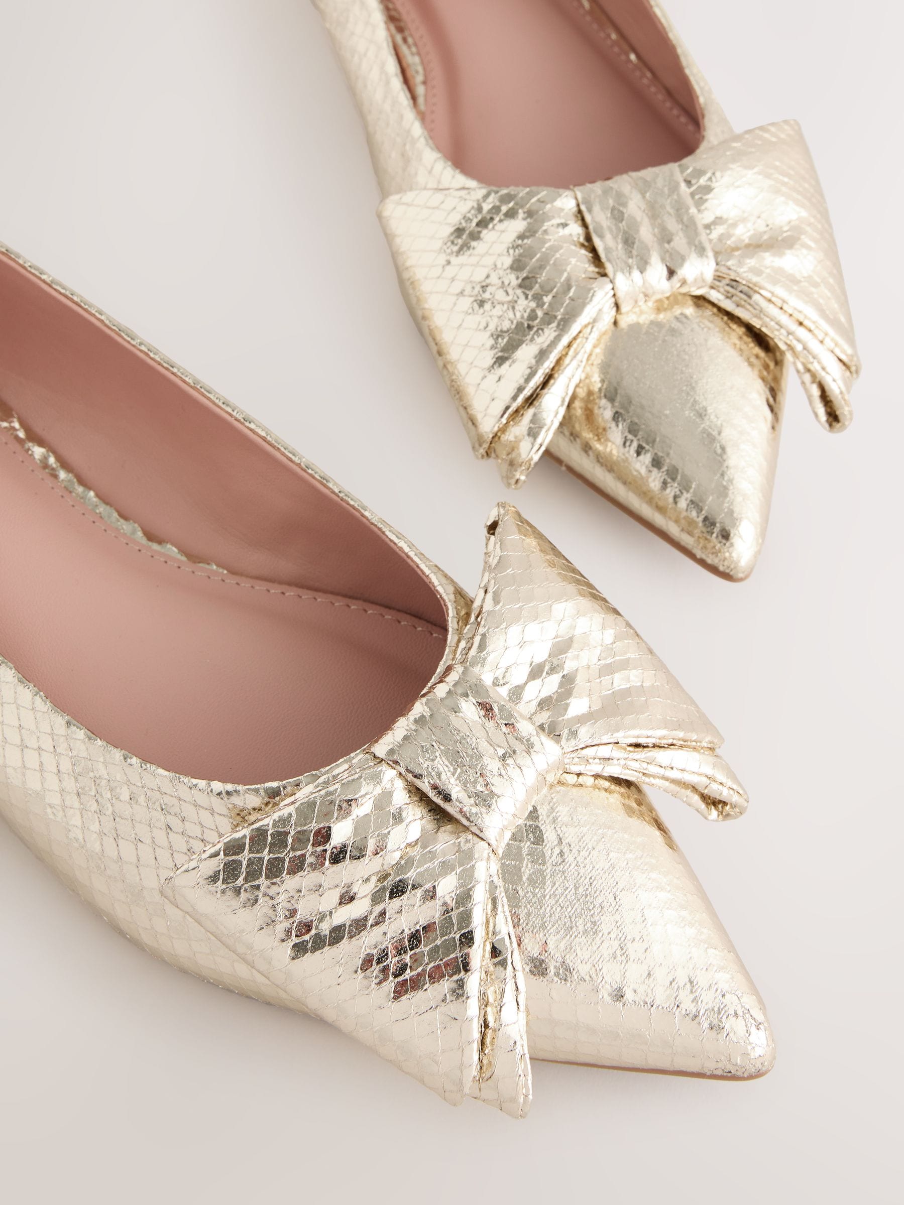Buy Gold Point Toe Bow Ballerinas from Next USA