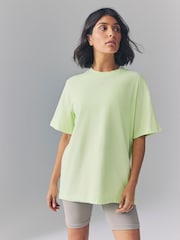 Nike Lime Green Oversized Mini Swoosh Sportswear T-Shirt - Image 1 of 4