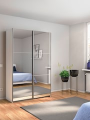 Rauch White Reflection Mirror Sliding Semi Fitted 1.3m Sliding Wardrobe with Additional Interior Shelves - Image 1 of 5