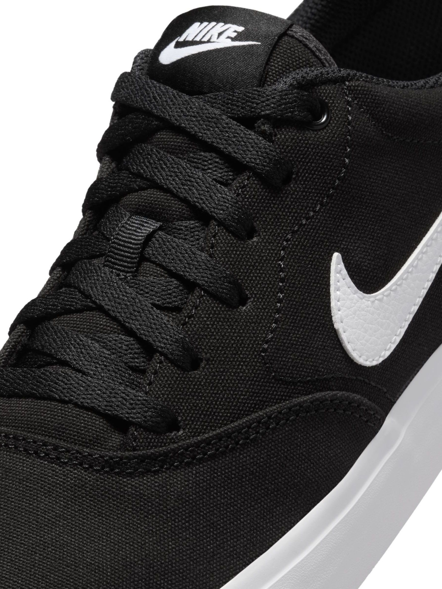 nike black canvas trainers