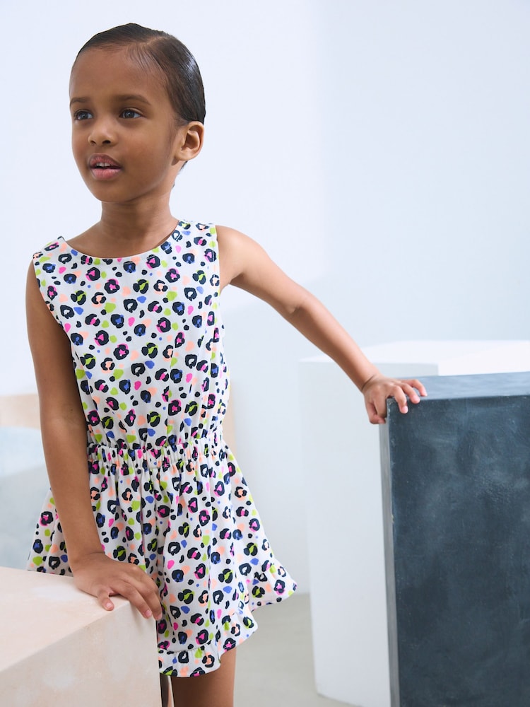 Leuchtender Leopardenprint - Overall mit Schleifendetail (3–16 J.) - Bild 1 von 4 Leuchtender Leopardenprint - Overall mit Schleifendetail (3–16 J.) - Bild 1 von 4
