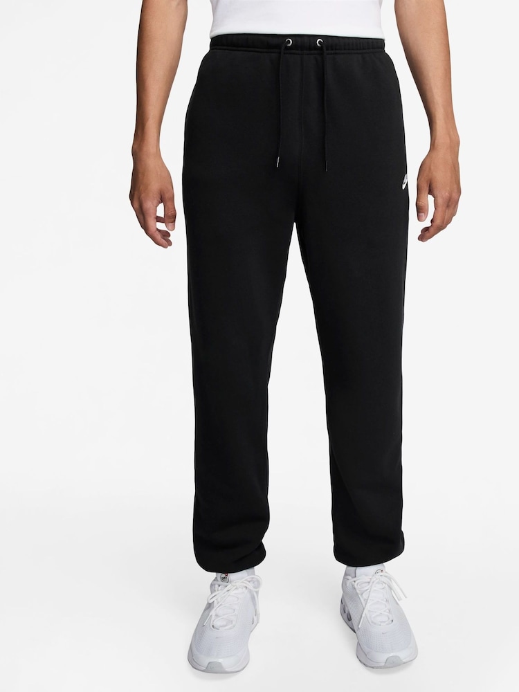 Черный - Флисовые спортивные брюки с манжетами Nike Club - Изображение 1 из 3