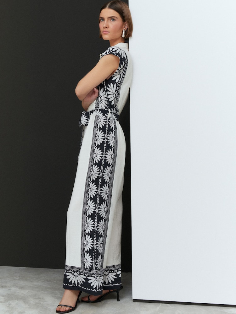White/Black Placement Floral Short Sleeve Tie Waist Placket Detail Jumpsuit - Image 1 of 8