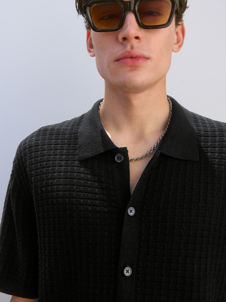 Black Relaxed Fit 100% Cotton Short Sleeve Textured Knit Button-Through Polo Shirt - Image 1 of 8 Black Relaxed Fit 100% Cotton Short Sleeve Textured Knit Button-Through Polo Shirt - Image 1 of 8