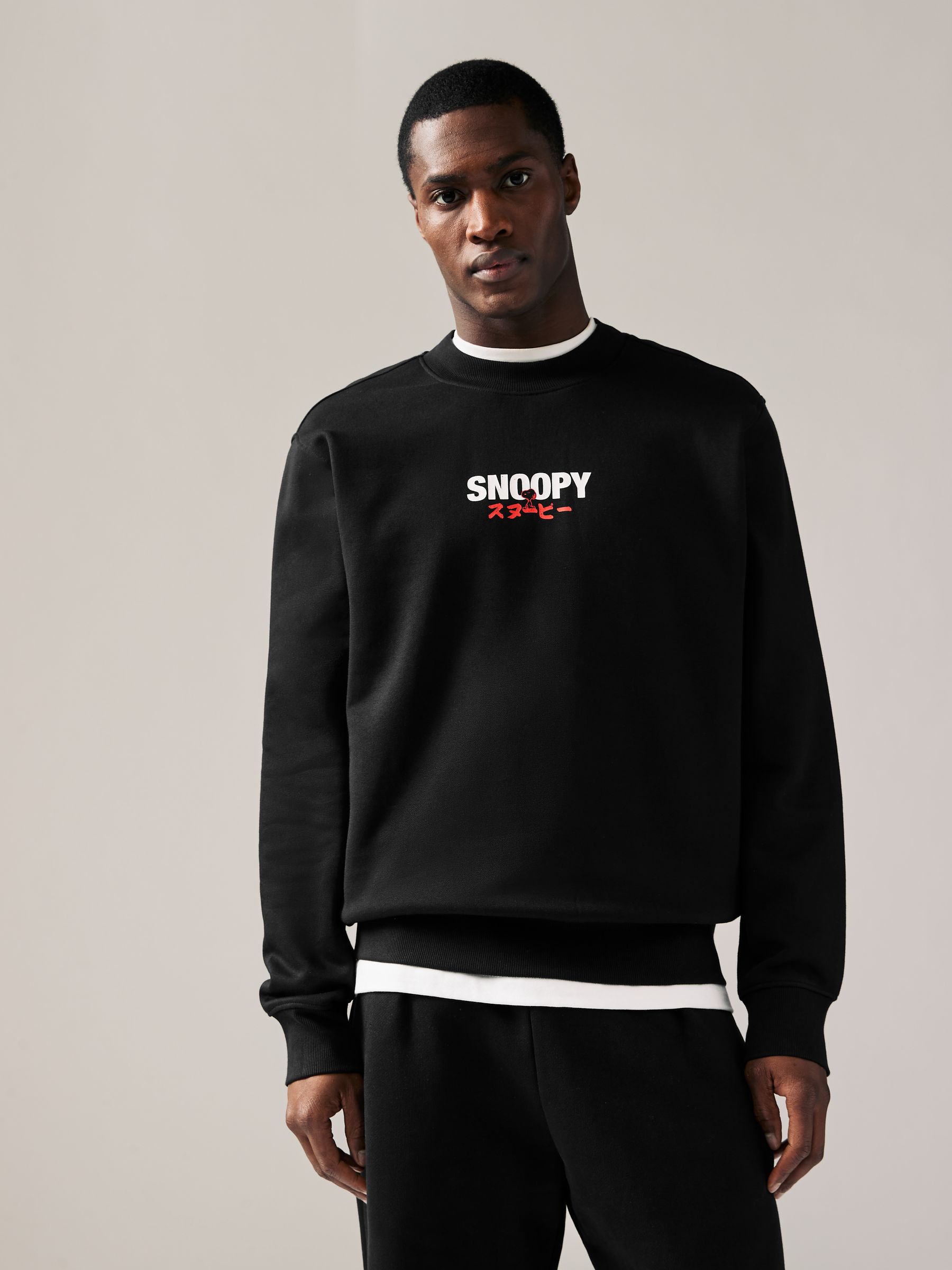 Buy Black Snoopy License Graphic Print Crew Sweatshirt from the