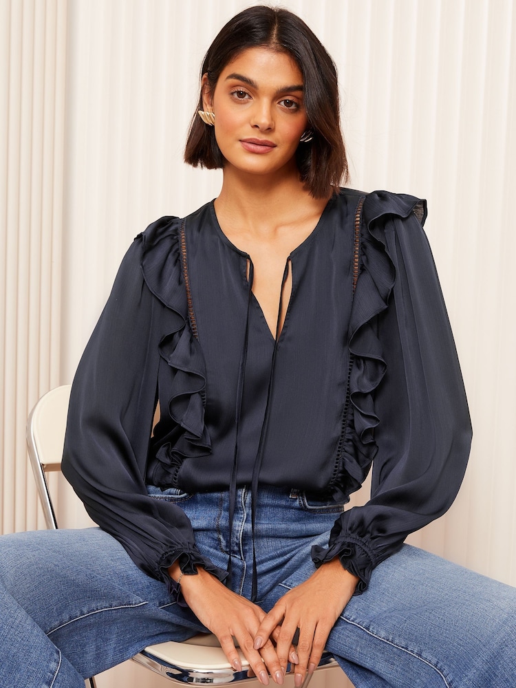 Friends Like These Navy Long Sleeve Ruffle Trim Tie Front Blouse - Image 1 of 1