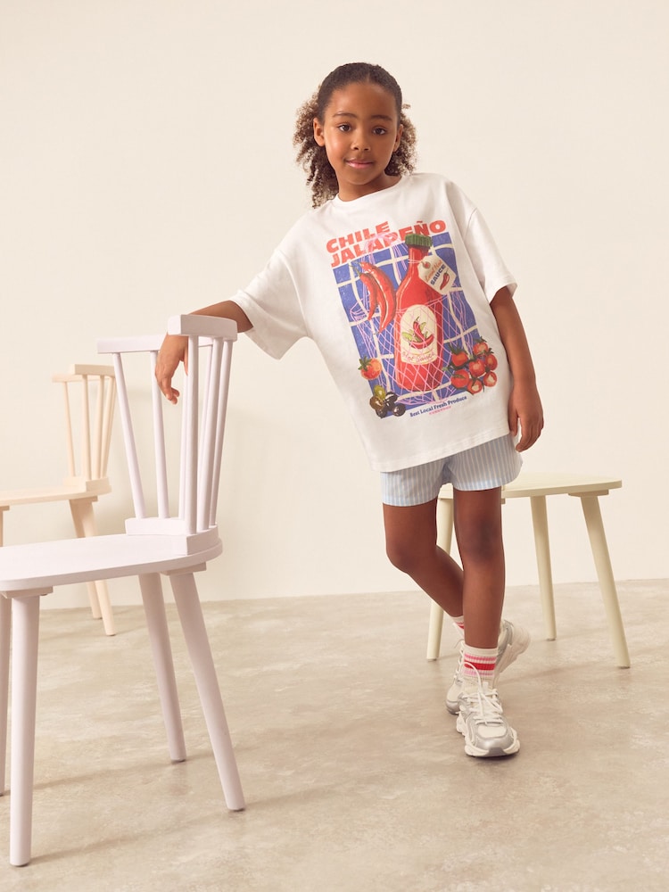 White/Blue Chilli Oversized 100% Cotton Graphic T-Shirt & Woven Shorts (3-16yrs) - Image 1 of 4 White/Blue Chilli Oversized 100% Cotton Graphic T-Shirt & Woven Shorts (3-16yrs) - Image 1 of 4