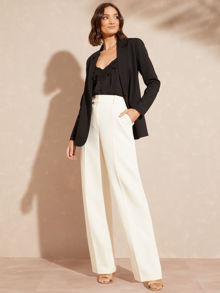 Marfil - Pantalones de tiro alto sartoriales con pernera ancha de Love & Roses - Imagen 4 de 4 Marfil - Pantalones de tiro alto sartoriales con pernera ancha de Love & Roses - Imagen 4 de 4