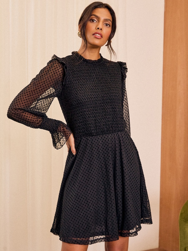 Love & Roses Black Mesh Spot Jersey Crew Neck Long Sleeve Mini Dress - Image 1 of 4