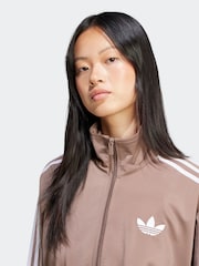 بني - رداء علوي رياضي فضفاض Firebird من adidas originals - صورة 7 من 9