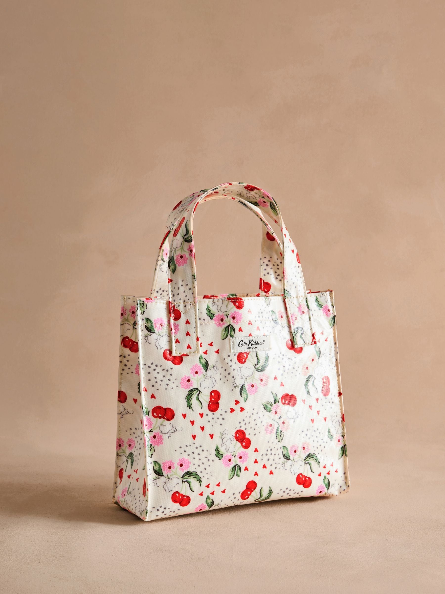 Buy Cath Kidston Ecru Cherry Small Coated Book Bag from Next USA Buy Cath Kidston Ecru Cherry Small Coated Book Bag from Next USA