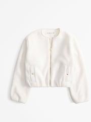كريم - سترة خفيفة فليس فرو شيربا بلا ياقة من Abercrombie & Fitch - صورة 1 من 1