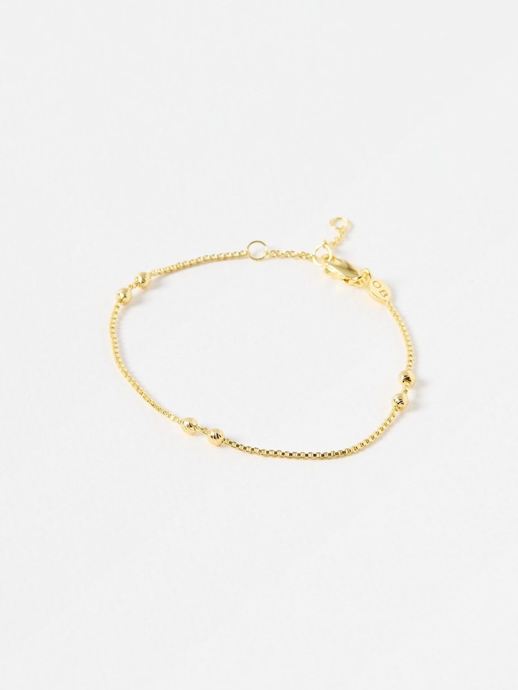 Oliver Bonas Gold Tone Brielle Box & Bead Detail Chain Bracelet - Image 1 of 3 Oliver Bonas Gold Tone Brielle Box & Bead Detail Chain Bracelet - Image 1 of 3
