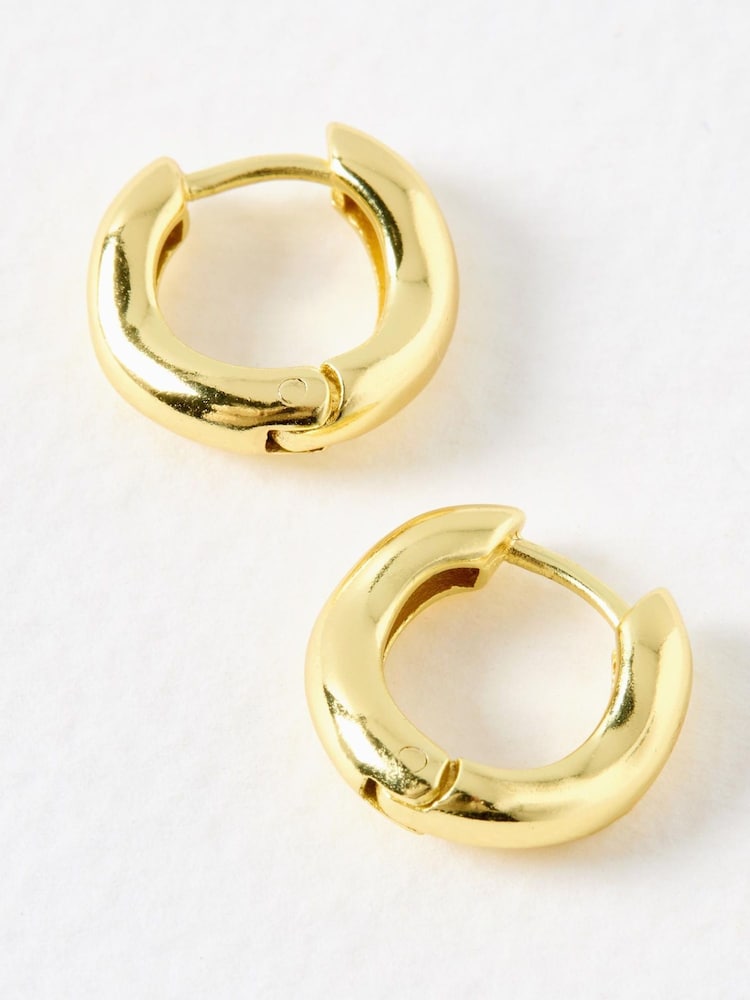 Oliver Bonas Gold Tone Ona Ripple Wave Huggie Hoops Small Earrings - Image 3 of 3 Oliver Bonas Gold Tone Ona Ripple Wave Huggie Hoops Small Earrings - Image 3 of 3