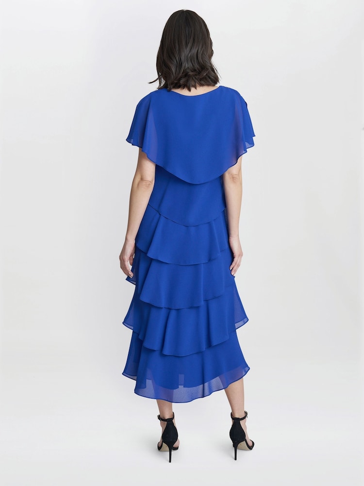 Vestido a media pierna escalonado azul con ribete en los hombros Rebecca de Gina Bacconi - Imagen 2 de 4 Vestido a media pierna escalonado azul con ribete en los hombros Rebecca de Gina Bacconi - Imagen 2 de 4