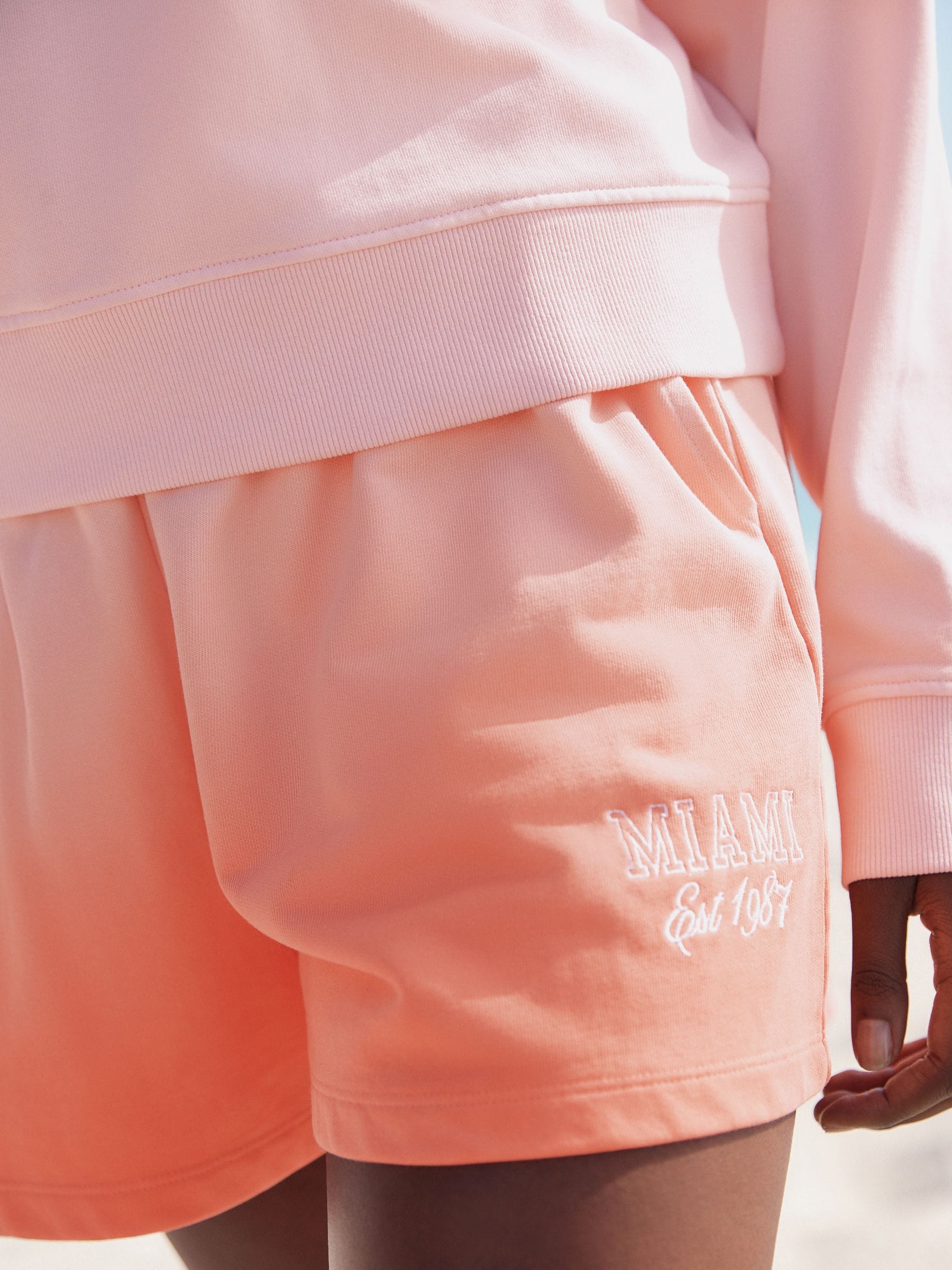 Buy Coral Pink Ombre Graphic Shorts from Next Romania