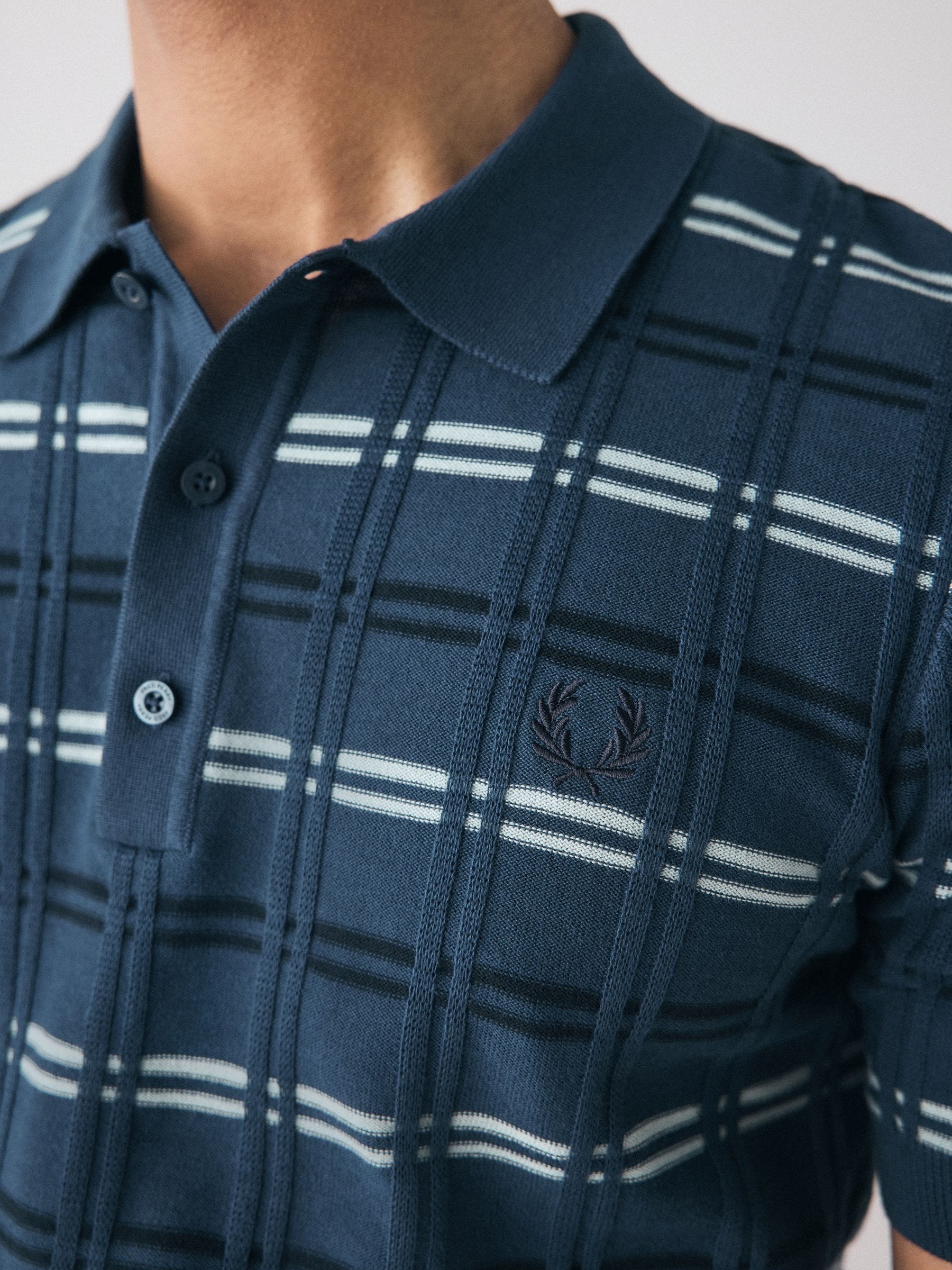 Buy Fred Perry Striped Rib Knitted Polo shirt from Next Oman