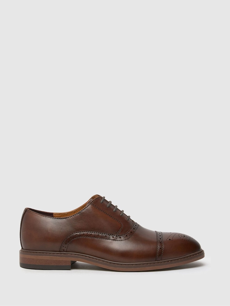 Schuh Raven Leather Brown gležnjar z luknjičastim vzorcem in vezalkami - Slika 1 iz 4 Schuh Raven Leather Brown gležnjar z luknjičastim vzorcem in vezalkami - Slika 1 iz 4