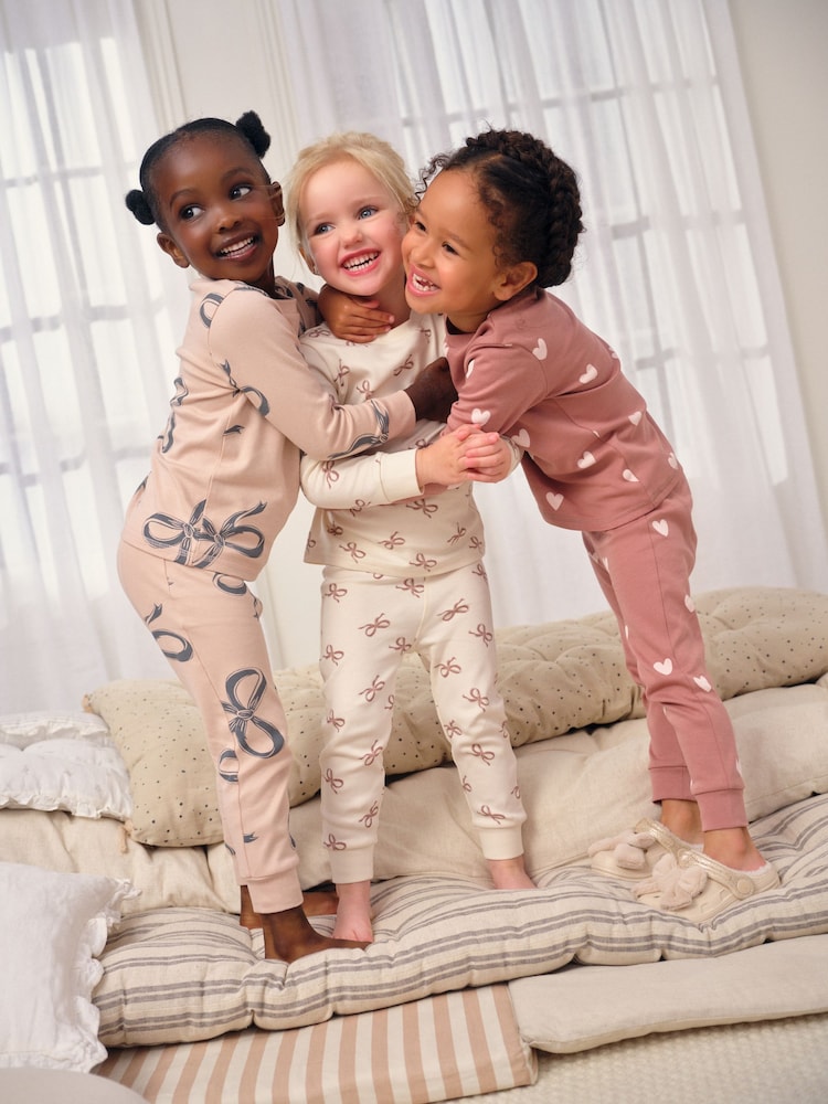 Ecru/Brown Bow Print Snuggle Pyjamas 3 Pack (9mths-12yrs) - Image 1 of 12 Ecru/Brown Bow Print Snuggle Pyjamas 3 Pack (9mths-12yrs) - Image 1 of 12