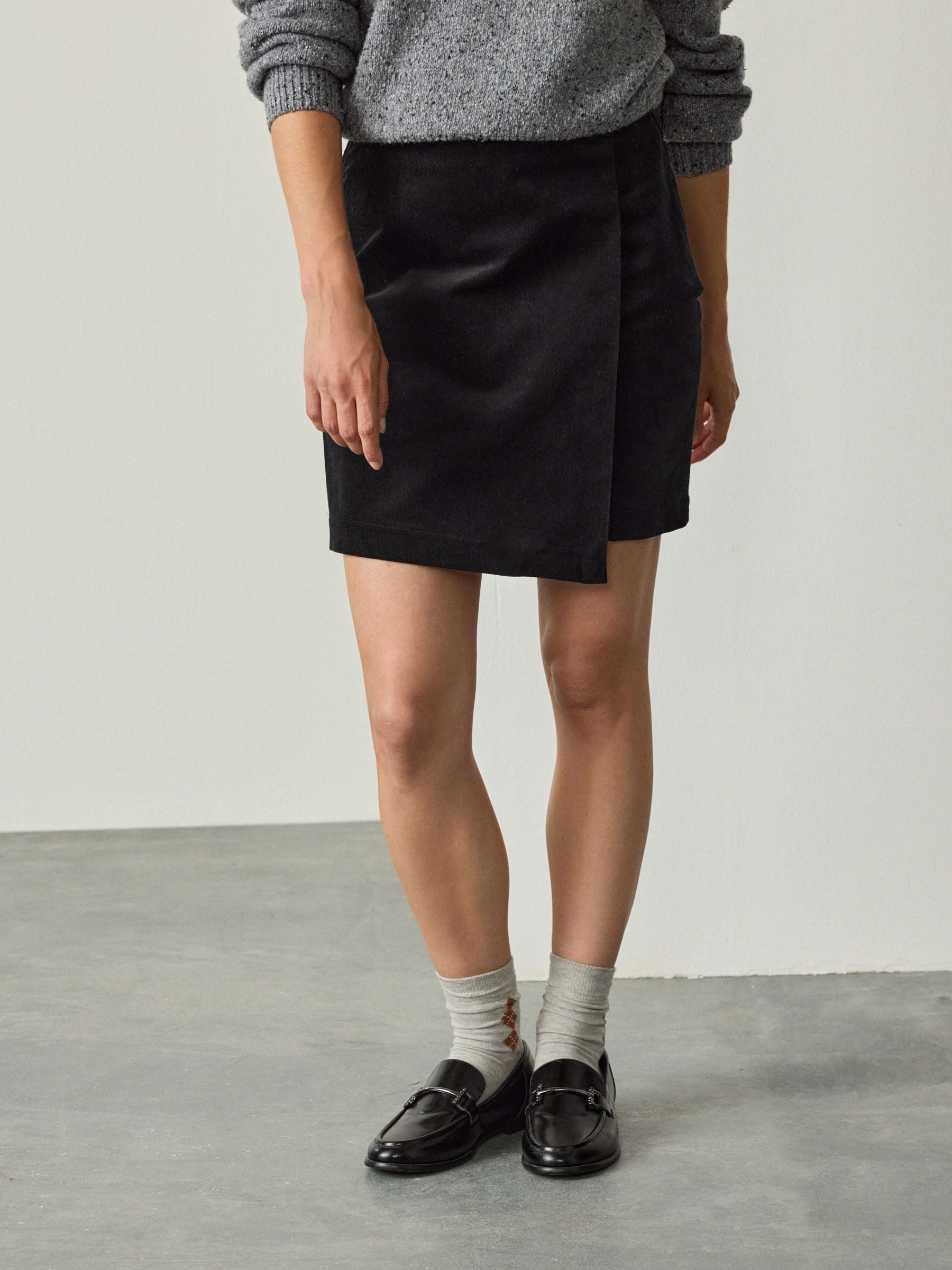 Buy Black Corduroy Mini Wrap Skirt from Next Romania