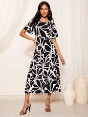 Friends Like These Black ITY Flutter Short Sleeve Midi Dress - Image 1 of 4
