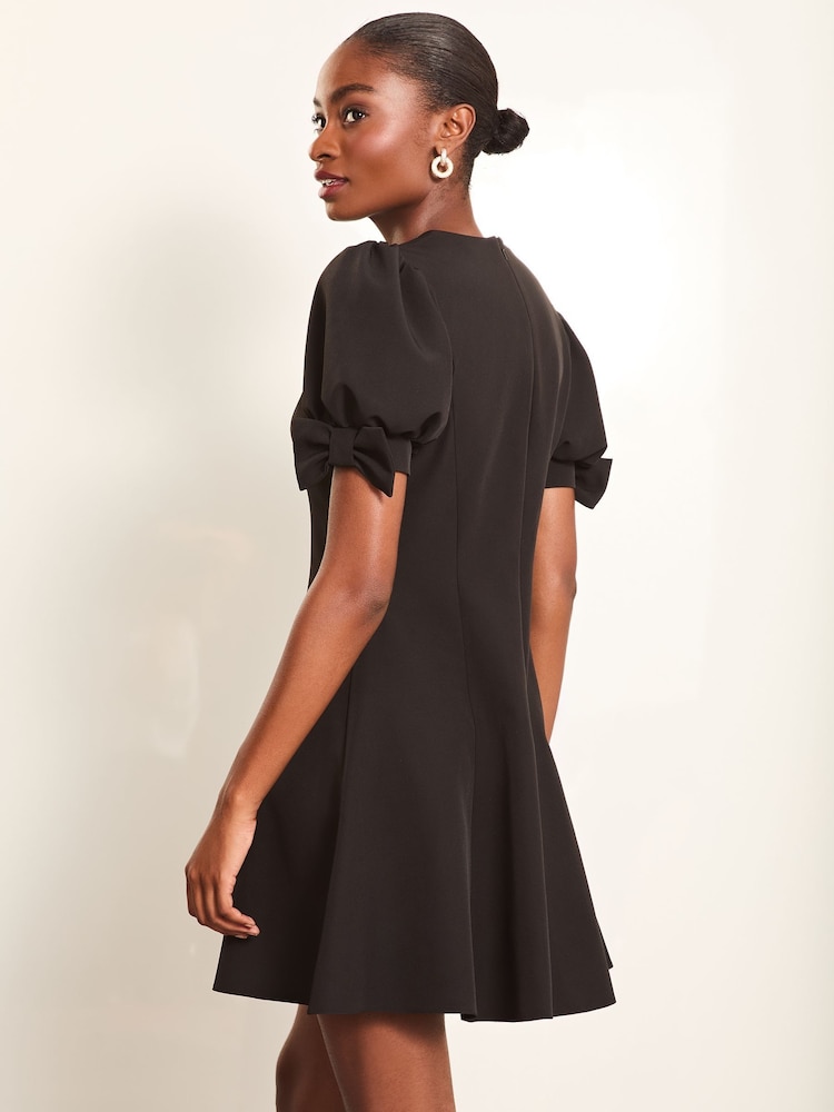 Lipsy Black Bow Detail Puff Sleeve Skater Mini Dress - Image 4 of 4 Lipsy Black Bow Detail Puff Sleeve Skater Mini Dress - Image 4 of 4