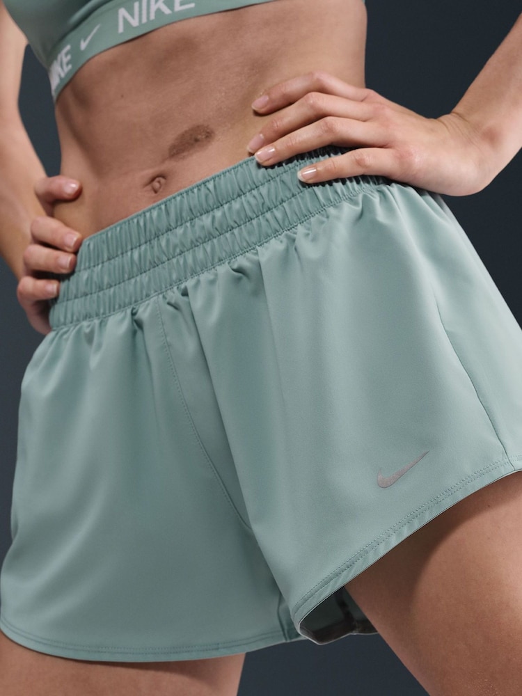 Nike Cannon Green One Dri-FIT Mid Rise 3 Inch Brief Lined Shorts - Image 1 of 5 Nike Cannon Green One Dri-FIT Mid Rise 3 Inch Brief Lined Shorts - Image 1 of 5