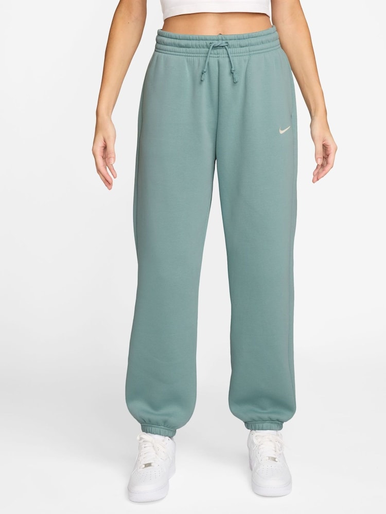 Nike Cannon Blue Sportswear Phoenix Fleece High-Waisted Oversized Joggers - Image 1 of 3 Nike Cannon Blue Sportswear Phoenix Fleece High-Waisted Oversized Joggers - Image 1 of 3