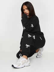 PixieGirl Petite Black Bow Detail Cuffed Joggers - Image 1 of 5